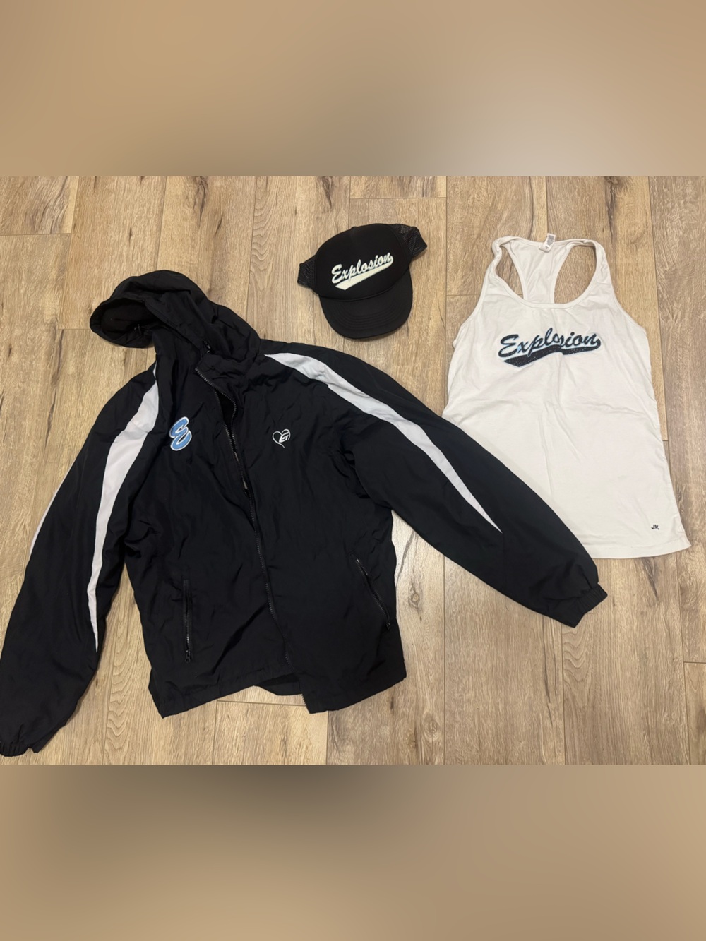 Explosion softball black jacket, black trucker hat and white tank top